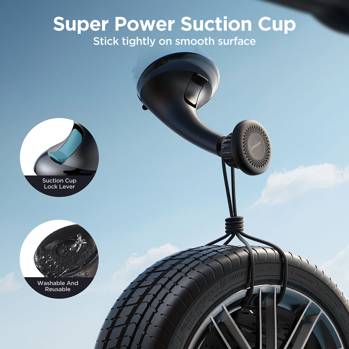 JOYROOM JR-ZS356 Magnetic Car Phone Holder shown lifting a tire, highlighting its powerful suction cup and reusable adhesive.